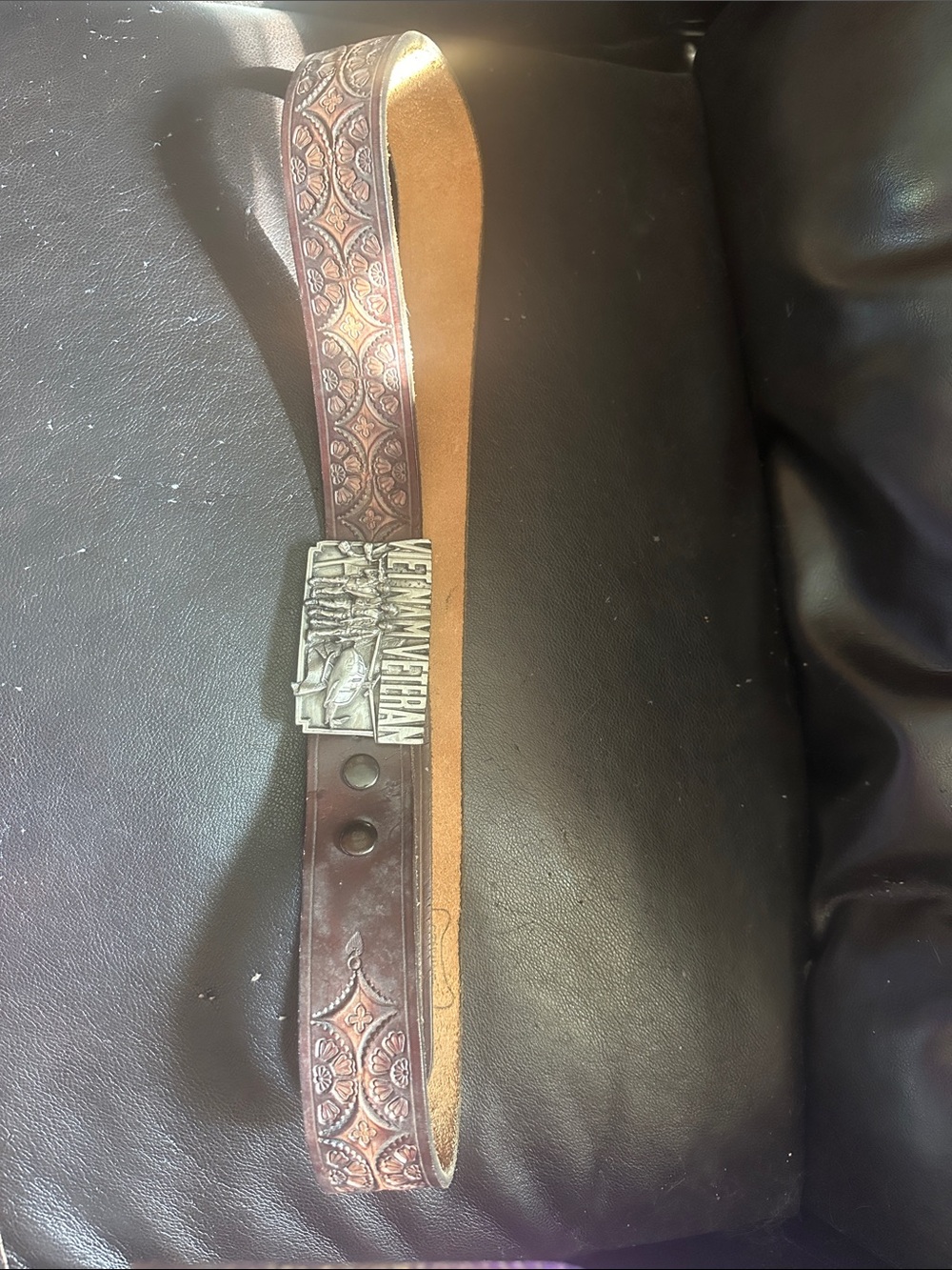 Tooled Brown Leather Menโs Belt with Decorative Buckle